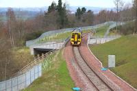 ScotRail 158749 crossing the A7 on Gore Glen Bridge southbound on 10 April 2016 with the 1024 Edinburgh - Tweedbank. The train is just under half a mile from its next stop at Gorebridge.  <br><br>[John Furnevel 10/04/2016]