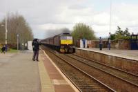 A railtour returning to Bridlington heads west at Wigton on 16 April 2016. Expectation of a steam locomotive heading this part of the tour had resulted in quite a few locals turning up but a Class 47 deputised. With the plume of exhaust it perhaps was trying to represent Galatea which had been booked to pass.<br><br>[John McIntyre 16/04/2016]