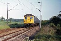 A Class 308/1 EMU is recorded between Wivenhoe and Hythe while working a Clacton/Walton to Colchester local service on 17th May 1976. These 1961 vintage units were replaced on this line by Class 313 EMUs in the early 1980s, but made a comeback after refurbishment and soldiered on for a few more years.<br><br>[Mark Dufton 17/05/1976]