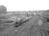 Looking north over the approaches Buchanan Street at Dobbies Loan on Saturday 16 April 1955. Black 5 45156 <I>Ayrshire Yeomanry</I> is about to enter the station with a train from Oban.<br><br>[G H Robin collection by courtesy of the Mitchell Library, Glasgow 16/04/1955]