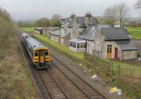 A Leeds to Morecambe service hurries past the closed station at Arkholme, now a private residence, on 18th April 2016. [See image 19610] Hopefully the regular <I>Little North Western line</I> passengers were appreciating the comfort of 158903 as services on these old jointed tracks are very often handled by Pacers.   <br><br>[Mark Bartlett 18/04/2016]