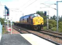EWS 37427 with a lightweight load southbound past Newcraighall station on 10 June 2002 heading for Millerhill yard. The new single platform station had been officially opened a week earlier.<br><br>[John Furnevel 10/06/2002]
