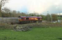 DB 66120, in EWS livery, takes the regular Hardendale (Shap) to Margam freight south through Bay Horse on the evening of 27th April 2016. The train is scheduled to leave Hardendale at 1826hrs and run via Shrewsbury and Hereford to arrive in Margam at 0439hrs.<br><br>[Mark Bartlett 27/04/2016]