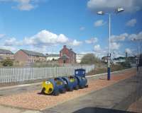 On the platform at Arbroath is a Dundee and Angus College barrel-train.<br><br>[John Yellowlees 30/04/2016]