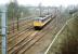 A pair of 'InterCity' liveried class 86 locomotives run north through the site of Beattock station in the spring of 1999 with a Virgin Rail WCML service. The second locomotive has its pantograph down.<br><br>[John Furnevel 05/04/1999]