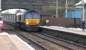 DRS class 66 locomotives 66304 and 66421 about to take the diverted Daventry to Mossend 'Tesco Express' container train through New Cumnock station on 18 February 2016.<br><br>[Ken Browne 18/02/2016]