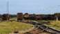 66 and steel related traffic in Margam Knuckle Yard looking south from the level crossing with the Margam Abbey Iron and Steel Works ('Port Talbot steelworks') behind the camera in 2006. The South Wales main line is to the left.<br><br>[Ewan Crawford 13/09/2006]