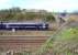 The 0845 Tweedbank - Edinburgh about to pass below Whitehill Road bridge as it slows for the stop at Newcraighall station on 17 April 2016. A photograph from this position has only recently become possible following the cutting back of trees and shrubs along the embankment running south from the bridge towards Millerhill Yard.<br><br>[John Furnevel 17/04/2016]