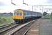 A Class 101 DMU passes through Wivenhoe station on 23rd August 1981. The train was a “Seaside Special” that had visited Clacton and Walton (where it had been stabled for the day). Chartered by the Fakenham and Dereham Railway Society, it is seen here returning home to stations between Wymondham and Ryburgh in Norfolk. [Ref query 4089]<br><br>[Mark Dufton 23/08/1981]