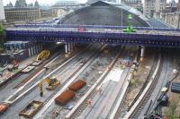 General view of the works at Queen Street station from Buchanan Galleries on 6th May 2016, day 48 of the closure for the tunnel and EGIP works. Platforms 1-6 have been realigned and extended northwards towards the tunnel and the track relaid, but pointwork has yet to be replaced. Platform 7 still has its old track and remains connected to the down line in the tunnel. New rails have been placed in the 'four foot' of the adjacent platform 6 road. Platform edges are nearing completion and the infill will follow. Some slabtrack for the tunnel works is stored in the station. Progress is reported to be on target for these works.<br><br>[Colin McDonald 06/05/2016]