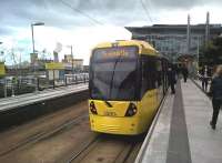 Metrolink trams to and from Eccles usually reverse at Media City. The unusual proboscis above the station notice board on the left in this April 2016 shot is part of the Imperial War Museum (North).<br><br>[Ken Strachan 16/04/2016]