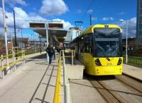 A tram turns back for Piccadilly at the recently opened Ashton-under-Lyne tram terminus on a warm and sunny April day in the Manchester area.<br><br>[Ken Strachan 16/04/2016]