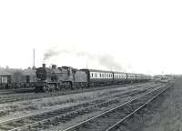 An Ardrossan Winton Pier - Glasgow St Enoch train approaching Kilwinning station on 4 July 1959 behind Fowler 2P 4-4-0 no 40624. <br><br>[G H Robin collection by courtesy of the Mitchell Library, Glasgow 04/07/1959]