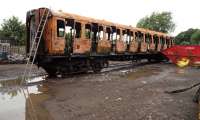 The ruined coach of the Swindon and Cricklade's Thumper Unit is now being stripped of any remaining good parts before being scrapped.<br><br>[Peter Todd 18/06/2016]