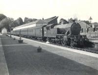 An afternoon train for Airdrie prepares to leave Milngavie platform 1 in the summer of 1957. Locomotive in charge is Gresley V1 2-6-2T 67618 of Kipps shed. <br><br>[G H Robin collection by courtesy of the Mitchell Library, Glasgow 02/07/1957]