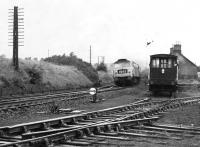 An unidentified Brush Type 4 brings the 1425 Stranraer Harbour - Newcastle Central through the closed station at Carronbridge. Thought to have been taken in the early 1970s. [Ref query 47971]<br><br>[Bruce McCartney Collection //]