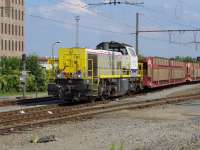 SNCB 7712 leaves Bruges Yard with empty car transporters for the docks on 24 June. NB The local Flemish spelling of Bruges is Brugge and the running-in boards have this spelling.  All train announcements were in Flemish ...<br><br>[Bill Roberton 24/06/2016]