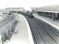 A Glasgow St Enoch - Largs train arrives at Kilwinning on 4 July 1959 behind 2P 4-4-0 40667.<br><br>[G H Robin collection by courtesy of the Mitchell Library, Glasgow 04/07/1959]