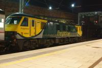 Freightliner 90042 waits at the north end of platform 4 at Preston in the early hours of 16 July 2016. The loco is one of the Freightliner Class 90s on hire to GBRF in order to work the Caledonian Sleeper services. This particular service was the 1S25 Highland Sleeper which normally runs from Euston to Inverness with some coaches coming off at Edinburgh for Aberdeen and Fort William however on this morning the main portion was only advertised to Perth.<br><br>[John McIntyre 16/07/2016]