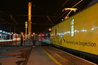 A Network Rail test train stops at Preston just before midnight  on 15 July 2016 whilst working from Blackpool to Derby, although not the direct route. The train had run earlier run via Preston, Blackburn, Hellifield, Carnforth, Morecambe (reverse), then back tracking to Blackburn where it travelled to Bolton(reverse) back to Blackburn (reverse) and then Preston (reverse). It finally headed south towards Derby with the overhead line inspection coach having the pantograph raised. What was noticeable was the foliage stuck in the pantograph which it appears to have collected earlier in the journey. The loco on the front for the next part of the journey was Inter City liveried 37254 and Colas liveried 37175 was on the rear.<br><br>[John McIntyre 15/07/2016]