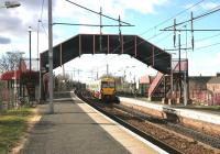 A train for Lanark about to pick up a solitary passenger at Bellshill on 13 February 2006.<br><br>[John Furnevel 13/02/2006]