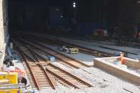 The new pointwork in place at the station throat awaits the arrival of a ballast train and RRV with grab [see image 55063]. The end of the rebuilt platforms 3 and 4 can be seen with a circular access shaft now installed. <br><br>[Colin McDonald 11/05/2016]