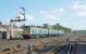 Southbound DMU passing the splitting distant (set for Greenhill) just south of the loops north of Larbert station in 1990. Access by kind permission of British Rail.<br><br>[Ewan Crawford //1990]