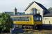 A Strathclyde PTE liveried Class 107 “Derby” unit pulls into Dunblane station in June 1991 with a service to Glasgow. Such old generation DMUs were becoming scarce at the time, increasingly displaced by Class 150, 156 and 158 units. The concrete block in the foreground supported a footbridge exit from platforms 2 and 3 to the west side of the station.<br><br>[Mark Dufton /06/1991]