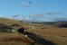 View south east over the Chalmerston Loading Pad loop, which occupies a site similar to the former Burnton Loop [see image 55783]. The original Laight Brae route to Watersite was to the left, now completely obliterated for the first mile. In the right background is the site of the Minnivey Nos 4&5 mine (opened in 1955 and closed in 1975) and the Burnton Washery. The site became the Scottish Industrial Railway Centre before relocation to Waterside. Pennyvenie 2,3&7 survived Minnivey, closing in 1978.<br><br>[Ewan Crawford 22/02/2004]