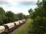 GBRf 66749 heads south along the former four track Midland Main line, shortly after passing the former Sandal & Walton station site, with a cargo of silica sand from Middleton Towers in Norfolk destined for the glassworks at Monk Bretton near Barnsley. The section of track forward of the loco originally ran through a tunnel, but was opened up when the line was increased from two tracks to four.  <br><br>[David Pesterfield 13/07/2016]