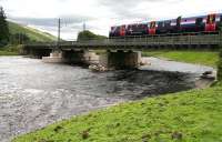 The 1309 Glasgow Central – Manchester Airport southbound across the Clyde over  Lamington Viaduct on 27 July 2016. Note the rebuilt piers and other repairs carried out following damage caused by storm <I>Frank</I> at the beginning of the year, which resulted in closure of the west coast main line for more than seven weeks. The train was running at what appeared to be normal line speed – certainly a lot faster than its sister unit was on reopening day on 22 February. [See image 54263] <br><br>[John Furnevel 27/07/2016]