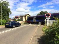 The level crossing at Cornton on 1st August 2016. Network Rail is seeking to close the existing vehicle and foot crossings at Cornton and replace them with a road bridge incorporating pedestrian and cycle access before the railway through Stirling is electrified in 2019. Plans were unveiled at two local public meetings in June 2016. <br>
<br><br>[Colin McDonald 01/08/2016]