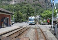 ABe 4-8 EMU No.54 heads west along the Centovalli (Hundred Valleys) narrow gauge line that links Locarno in Switzerland with Domodosolla in Italy. This view taken from the rear of a Locarno bound service in Ponte Brolla station, one of many passing loops on this very scenic 52km line. <br><br>[Mark Bartlett 22/06/2016]