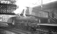 45742 <I>'Connaught'</I> standing under the footbridge on the centre road at Carlisle on 26 October 1964. The Jubilee is waiting to relieve the locomotive off the incoming 9.25am Crewe - Perth.<br><br>[K A Gray 26/10/1964]