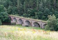 The 1863 Neidpath Viaduct which carried the Symington, Biggar and Broughton Railway across the Tweed a mile west of Peebles. Photographed on 4 August 2016 looking south east from alongside the A72.<br><br>[John Furnevel 04/08/2016]