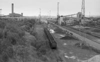 Looking north over the east side of British Steel Ravenscraig post closure. This was the iron ore unloading yard with the stockyard to the right and the sinter plant in the distant left. The Wishaw Deviation of the WCML is to the left.<br>
<br><br>[Bill Roberton 01/08/1992]