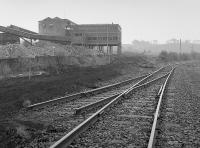 A 1988 visit finds the Dunaskin Central Washer (known as the Burnton Washer) soon to be demolished with the disused Culter sidings to the right. The washery sidings and lifted and the 'new' Chalmerston line has not yet been laid.<br><br>[Bill Roberton //1988]