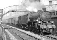 An up freight runs under the footbridge at Low Buckholmside on the northern approach to Galashiels station in April 1964. Locomotive in charge is St Margarets B1 4-6-0 no 61341. <br><br>[Dougie Squance (Courtesy Bruce McCartney) /04/1964]