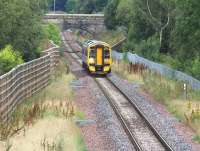 Passing the site of Hardengreen Junction on the approach to Eskbank station on Sunday 14 August 2016 is the ScotRail 1011 Edinburgh - Tweedbank.<br><br>[John Furnevel 14/08/2016]