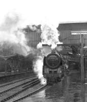 Britannia Pacific 70003 with a northbound train on a wet day at Carlisle in the 1960s.<br><br>[Dougie Squance (Courtesy Bruce McCartney) //]