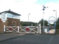 The level crossing at Haydon Bridge, Northumberland, in September 2003. At this time the crossing gates were still manually operated using a wheel within the signal box. [The gates have since been replaced by modern lifting barriers.]<br><br>[John Furnevel 22/09/2003]