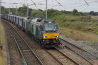 Two nearly new DRS Class 68s, 68020 <I>Reliance</I> and 68018 <I>Vigilant,</I> take the <I>Tesco Express</I> north through Hest Bank on a gloomy 20th August 2016. <br><br>[Mark Bartlett 20/08/2016]