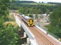 Crossing the Gala Water on the northern approach to Galashiels on 4 August 2016 is ScotRail 158730 forming the 1154 Edinburgh - Tweedbank. The train has just passed the site of Kilnknowe Junction and will shortly make the Galashiels stop.<br><br>[John Furnevel 04/08/2016]