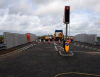 Contractors put the finishing touches to the replacement A706 overbridge at Breich Station. The bridge was due to open later that day and is one of 17 to be replaced prior to electrification.<br><br>[Colin McDonald 31/08/2016]