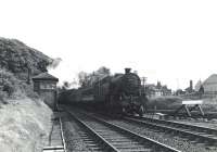 A Sunday St Enoch - Largs train emerges from Fairlie Tunnel and runs through the junction on 5 July 1959, hauled by Corkerhill Fairburn tank 42191.<br><br>[G H Robin collection by courtesy of the Mitchell Library, Glasgow 05/07/1959]