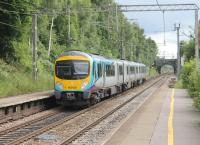 Sporting the revised livery that will be applied to the new trains on order for Trans-Pennine, 185108 passes through Heald Green on 17th June 2016. The train is signalled for the sharp right turn onto the Airport branch, just beyond the bridge. <br><br>[Mark Bartlett 17/06/2016]