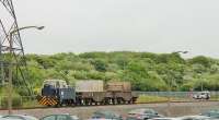 Sentinel 4wDM Shunter H055 (10037/1960) is propelling two nuclear flask wagons towards a loading point at Heysham Power Station on 26th May 2016. The Land Rover ahead of the train is protecting an ungated level crossing. NOTE: The power stations are a licensed nuclear site where photography is restricted. This picture taken with the kind permission of EDF-Energy and the Civil Nuclear Constabulary. <br><br>[Mark Bartlett 26/05/2016]