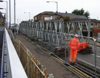 The temporary bridge which will carry pedestrians and diverted utility services across the railway takes shape on the condemned Station Road overbridge at Shotts. It is due to be craned in to position on 18th September.<br><br>[Colin McDonald 14/09/2016]