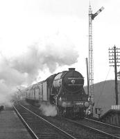 Preserved A3 Pacific 4472 with the <I>Flying Scotsman Anniversary Special</I> on 16 April 1966. The special, which ran between Northallerton and Inverkeithing, marked the third anniversary of the purchase of the locomotive by Alan Pegler. The outward journey ran over the ECML, with the return south via the Waverley route. It is seen here on the return journey about to run through Belses station. [See image 27918]<br><br>[Dougie Squance (Courtesy Bruce McCartney) 16/04/1966]