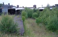 Wolverhampton Low Level, unloved and abandoned with a road driven through its east end, in 2003. But plans were afoot and the site was surrounded by security fencing on all sides.<br><br>[Ewan Crawford 03/07/2003]